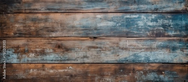 Fototapeta A detailed closeup of a hardwood wall stained with a blue color, showcasing the natural beauty of the wood grain pattern