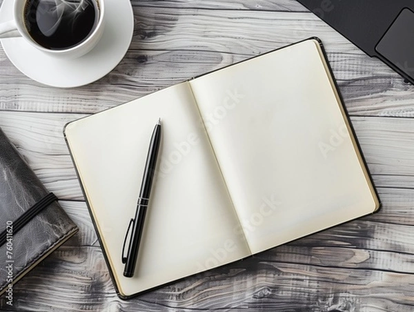 Obraz Blank page notebook For writing any text, there is a black pen, hot black coffee and a laptop on a wooden table.