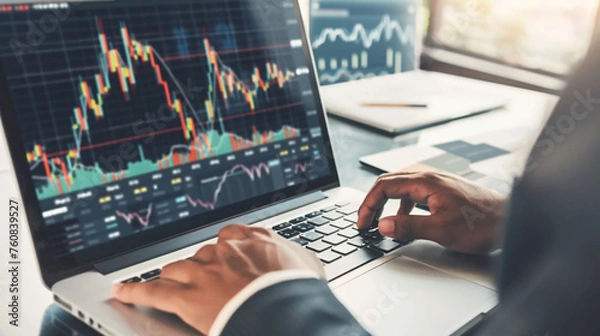 Fototapeta man checking stock market charts on the laptop, hands close up
