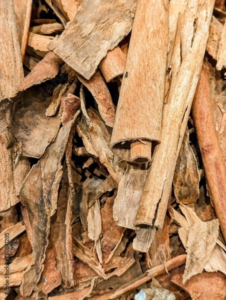 Fototapeta Cinnamon bark on sale at a local market in the Caribbean. It is usually ground to powder before sold in the western world.