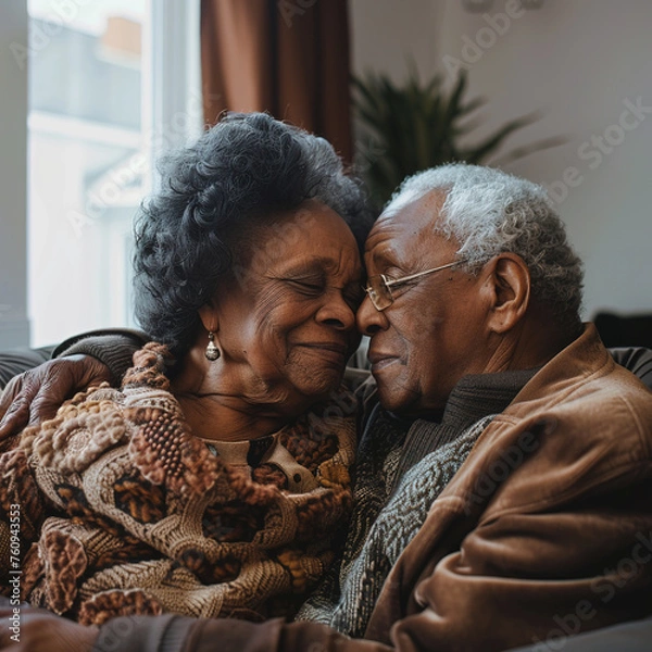 Obraz Mature elderly black couple sitting on couch looking at each other