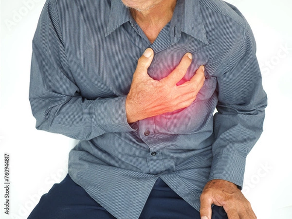Obraz Asian man having severe chest pain as heart attack and illness concept on white background. closeup photo, blurred.