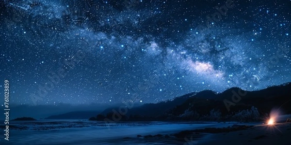Fototapeta Majestic Milky Way galaxy illuminating the night sky over a serene beach with gentle waves, capturing the awe of the cosmos