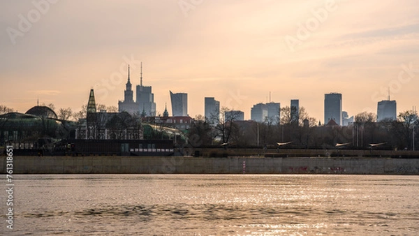 Fototapeta Warsaw, Poland - panorama of a city skyline at sunset. Cityscape view of Warsaw. Skyscrapers in Warsaw. Sunset over the river