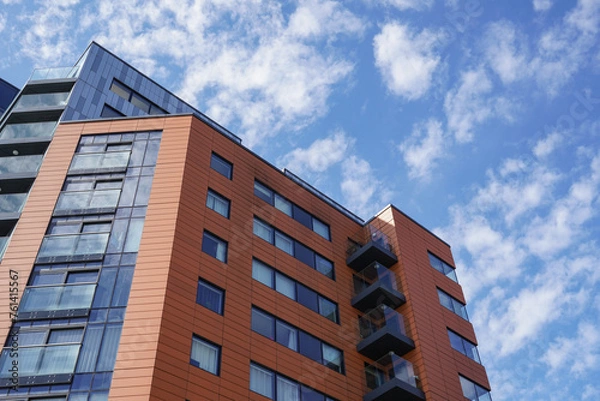 Fototapeta Apartment tower block in city. residential building exterior. modern housing development 