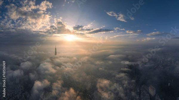 Fototapeta 
The top of the Landmark 81 building, the tallest in Vietnam, floats in the clouds. Photo taken in October 2023