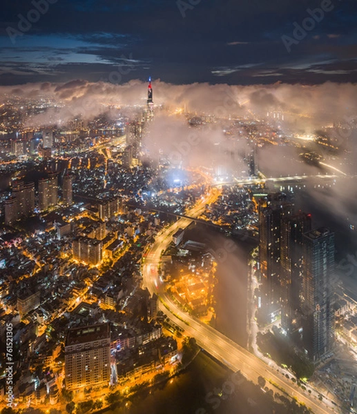 Fototapeta 
Sunrise on the tallest Landmark 81 building in Vietnam, with a beautiful curved road. Photo was taken in July 2023.