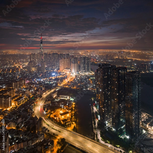 Fototapeta 
Sunrise on the tallest Landmark 81 building in Vietnam, with a beautiful curved road. Photo was taken in July 2023.
