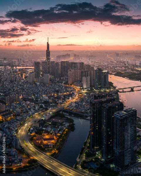 Obraz Sunrise on the tallest Landmark 81 building in Vietnam, with a beautiful curved road. Photo was taken in May 2023.