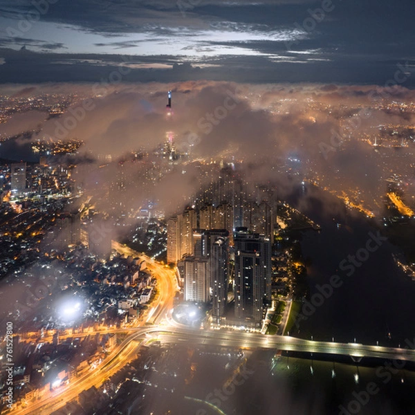 Fototapeta 
The top of the Landmark 81 building, the tallest in Vietnam, floats in the clouds. Photo taken in July 2023
