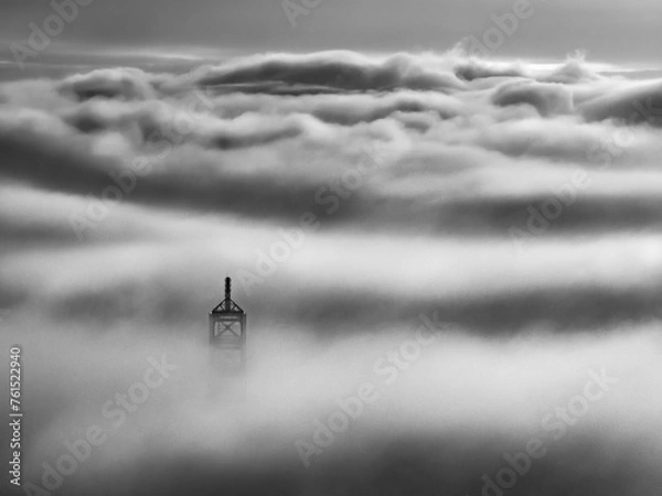 Fototapeta The top of the Landmark 81 building, the tallest in Vietnam, floats in the clouds. Photo taken in May 2023
