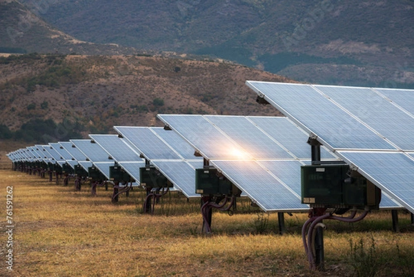 Fototapeta Solar power station. Solar panels, photovoltaics, alternative source of electricity - concept of sustainable and renewable sources.