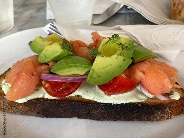 Obraz Toast topped with cream sauce, salmon, tomato and avocado
