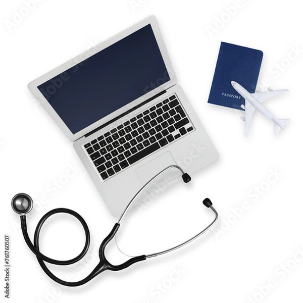 Obraz Top view of passport with airplane, computer and a stethoscope isolated on white background, medical insurance travel concept whether it's a summer beach vacation or a business trip. Health and safety