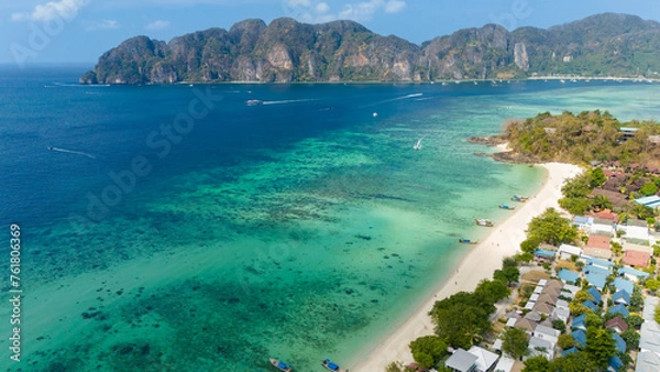 Fototapeta Long beach at Koh Phi Phi island, Krabi, Thailand. Tropical paradise white sand beach with turquoise waters of Andaman sea, aerial view towards Tonsai bay.
