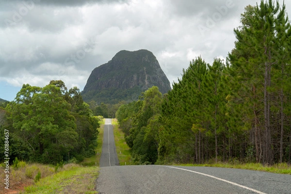 Fototapeta Scenery at Mount Beerwah, Queensland, Australia: Towering volcanic peak surrounded by lush forests, rugged cliffs, and sweeping vistas, a testament to its ancient volcanic origins