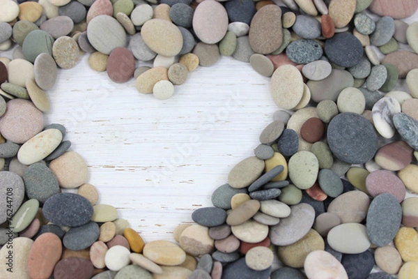 Obraz Heart shape made with pebbles on a white distressed wood backgro