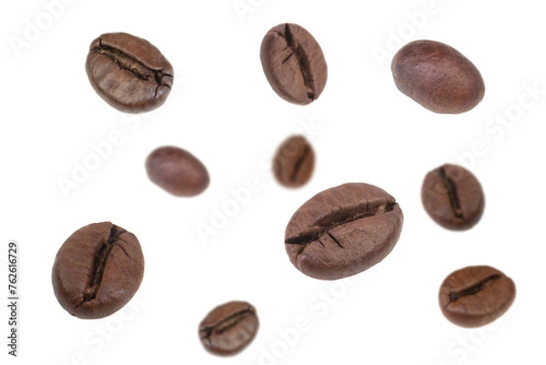 Fototapeta Falling coffee beans isolated on white background. Flying defocused coffee beans. Applicable for cafe advertising, packaging, menu design.