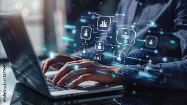 Fototapeta Businessman uses laptop for online document management, surrounded by floating file icons, showcasing technology's role in enhancing efficiency.