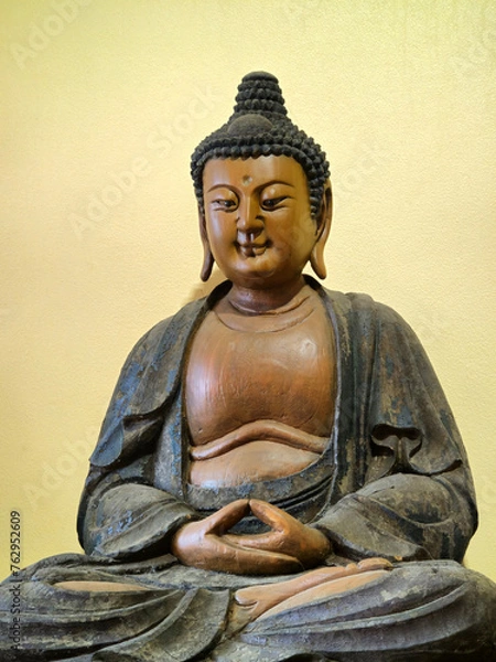 Obraz wooden Buddha statue in sitting position At Pho Guang Shan Temple, Thailand