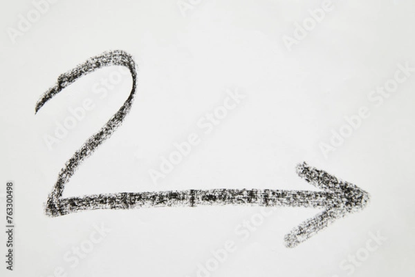 Fototapeta Wavy graceful smooth Hand drawn black chalk arrows. The concept of business, choosing direction, moving forward. Abstract sign, background, texture. Blurred