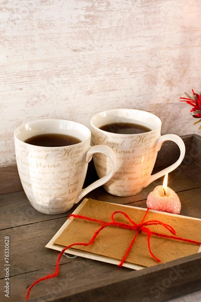 Fototapeta Valentine greeting card with two cups on wooden tray