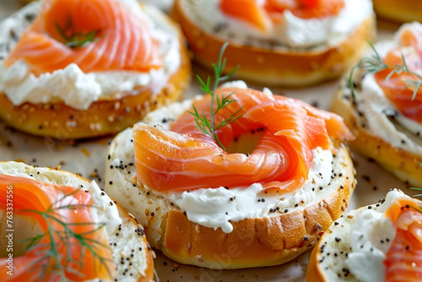 Fototapeta Close-up of bagels with cream cheese and smoked salmon, ideal for food blogs and menus.