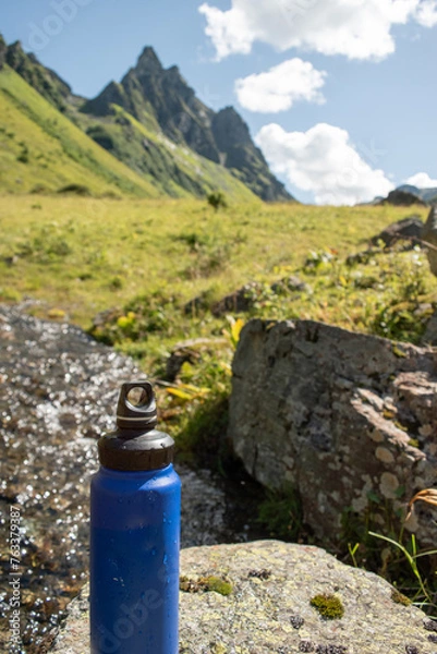 Obraz  Eco-Friendly Water Bottle by a Mountain Stream