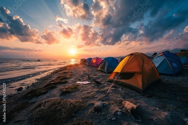 Fototapeta Cute tourist tents stand on the ocean sea shore in a campsite	
