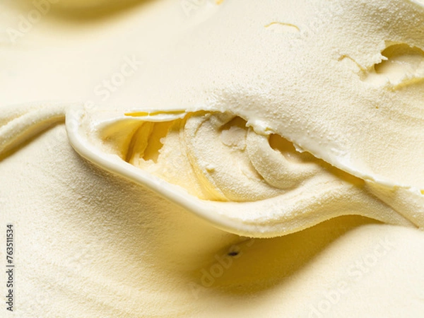 Fototapeta Vanila flavour gelato - full frame detail. Close up of a beige surface texture of vanilla Ice cream.