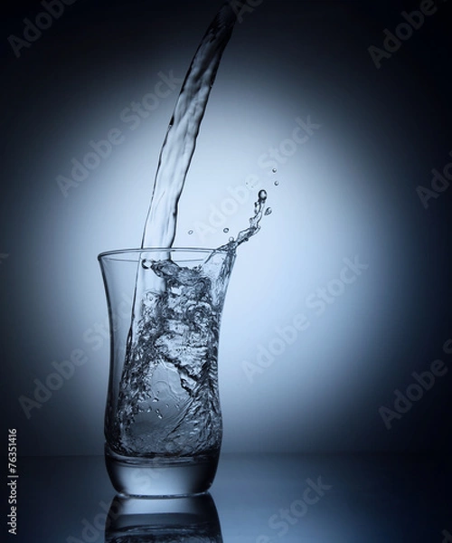 Obraz Water pouring into a glass
