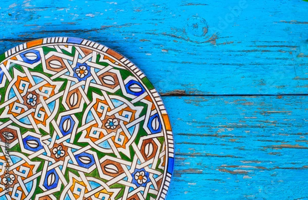 Obraz Vintage Plate on wooden background in blue color