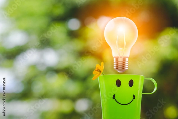 Obraz light bulb on green background