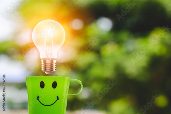 Obraz light bulb on green background