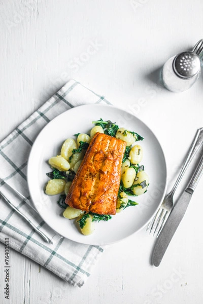 Obraz Grilled salmon with gnocchi and greens