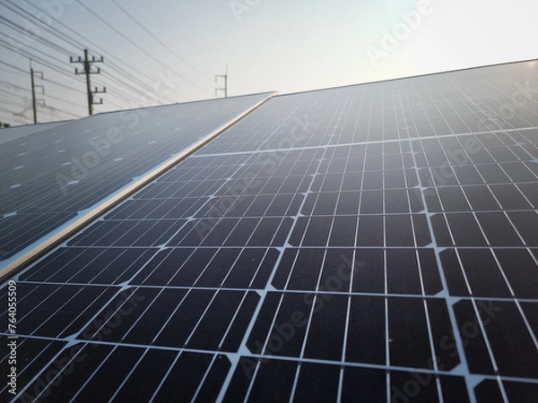 Obraz solar panel with sunlight and blue sky background. concept clean energy power in nature