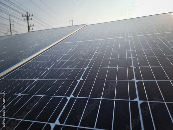 Obraz solar panel with sunlight and blue sky background. concept clean energy power in nature