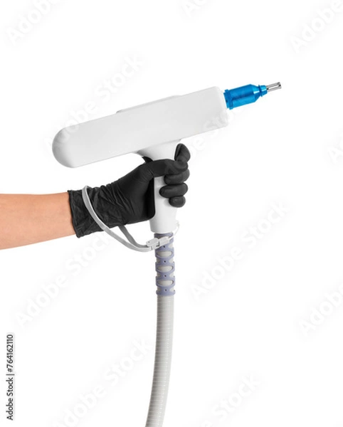 Obraz The hand of a cosmetologist holds a laser manipulator with a nozzle for tattoo removal