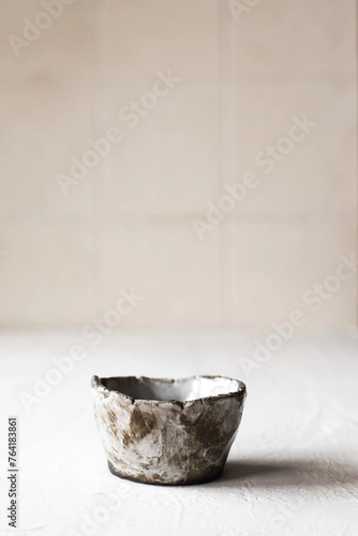 Obraz Ceramic tea bowl. Handmade ceramic sauce pan. Minimalism style. Front view. Japanese ceramics. Tea ceremony. Close-up.
