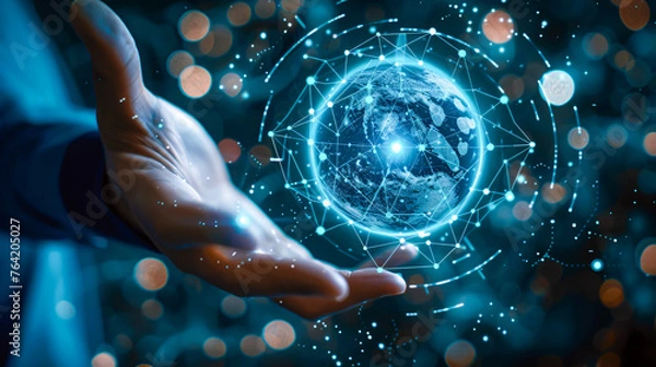 Fototapeta Concept of global connectivity, with a businessman holding a glowing digital globe, symbolizing the power of networking
