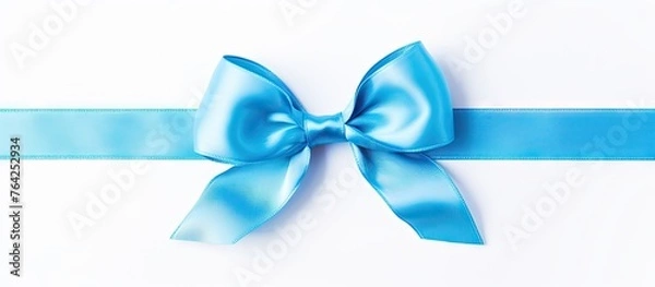 Fototapeta A blue ribbon with a bow