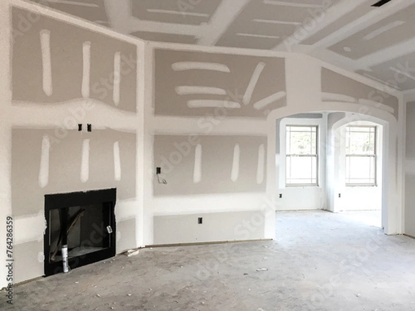 Obraz Drywall and taping interior of house construction