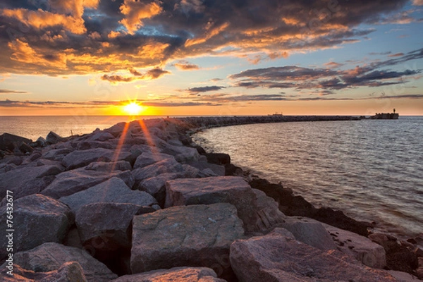 Fototapeta Sunset over breakwater