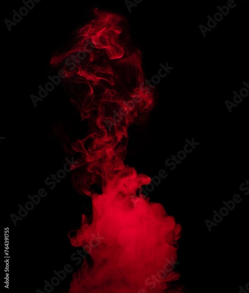 Fototapeta Abstract background of chaotically mixing puffs of red smoke on a dark background