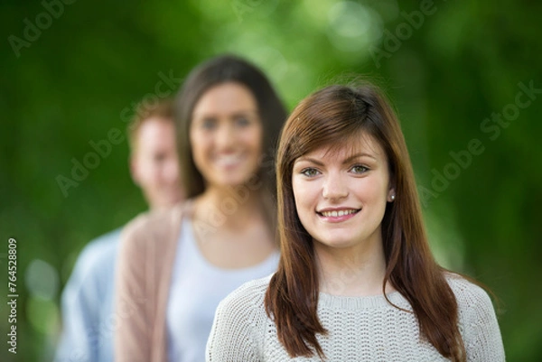 Fototapeta Portait of a small group of adults.