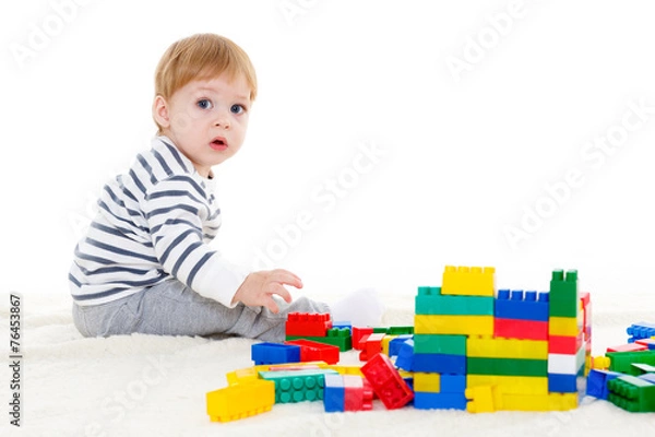 Fototapeta Little baby with educational toys.