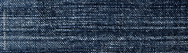 Fototapeta Close-up of denim fabric showing detailed texture and frayed edges