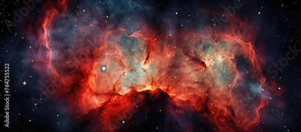 Fototapeta An image showing a detailed view of a nebula filled with stars in the vast darkness of space