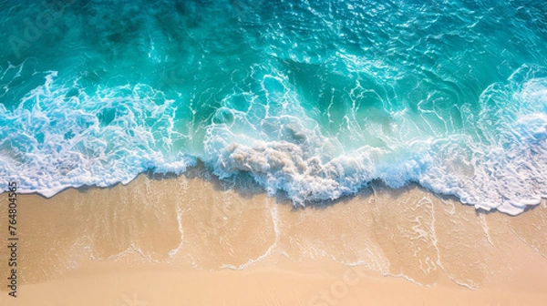Fototapeta Serene Shoreline aerial view: Pristine Sandy Beach Meeting Gentle Turquoise Waves