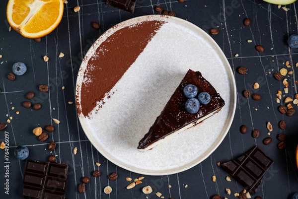 Obraz Cheesecake slice with melted and crushed chocolate